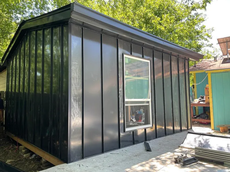 Black standing seam metal wall panels for Roof Inspection in Prichard